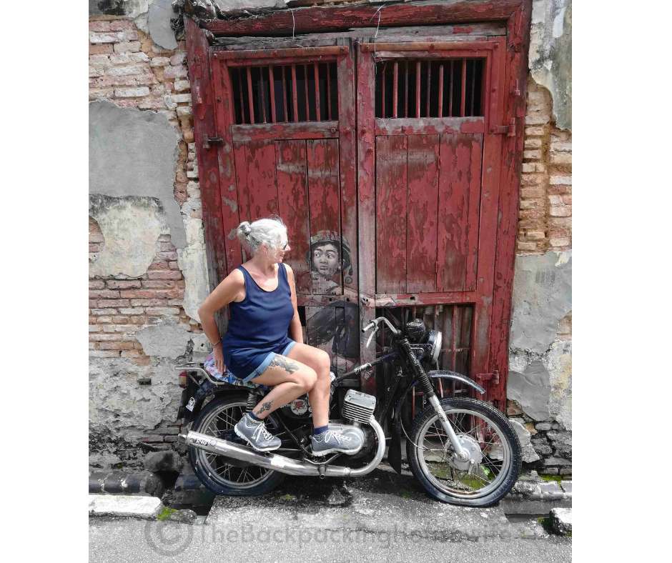 Backpacking Housewife Boy on a Motorbike by Ernest Zacharevic from 2012